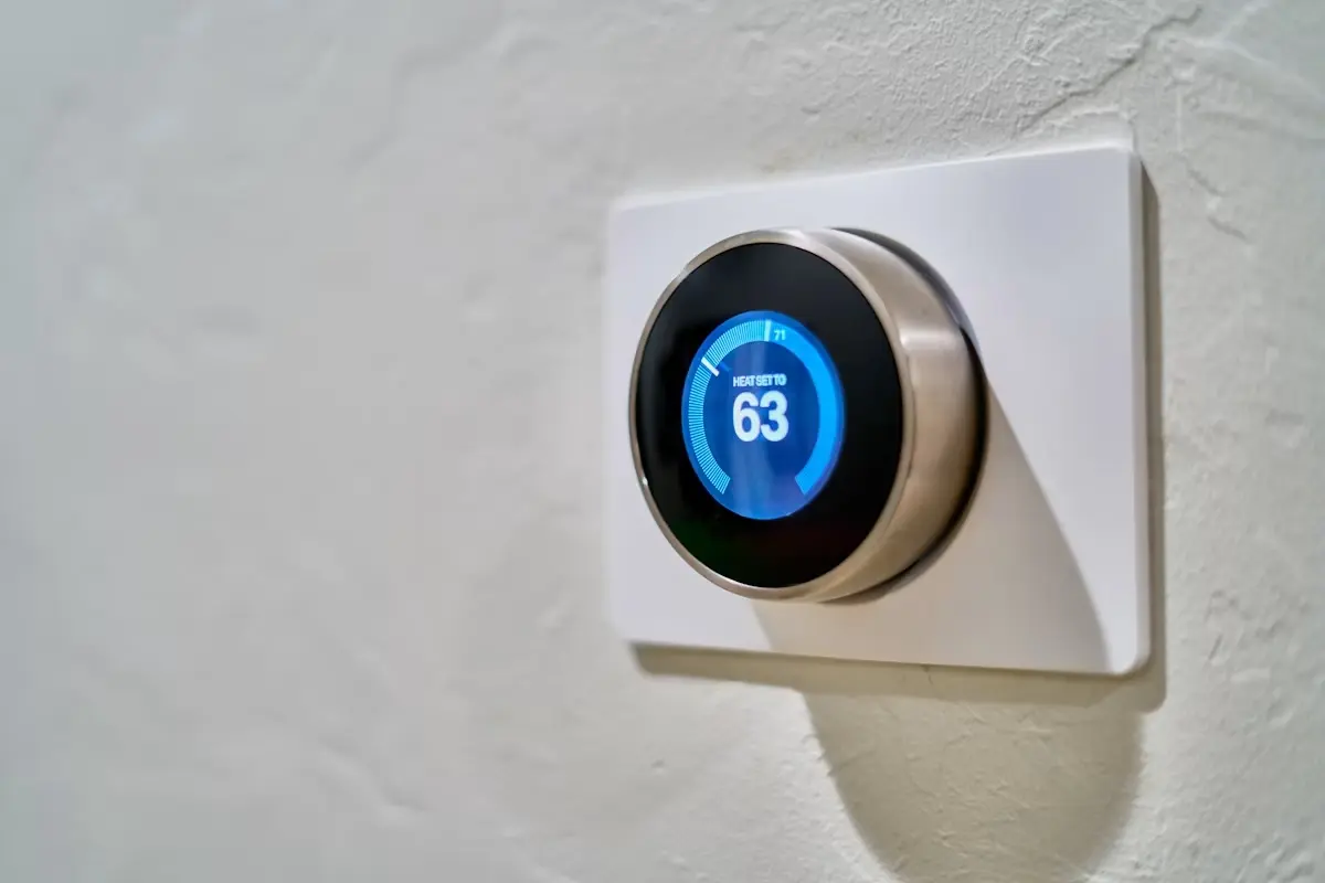 Smart thermostat showing a scheduled temperature
