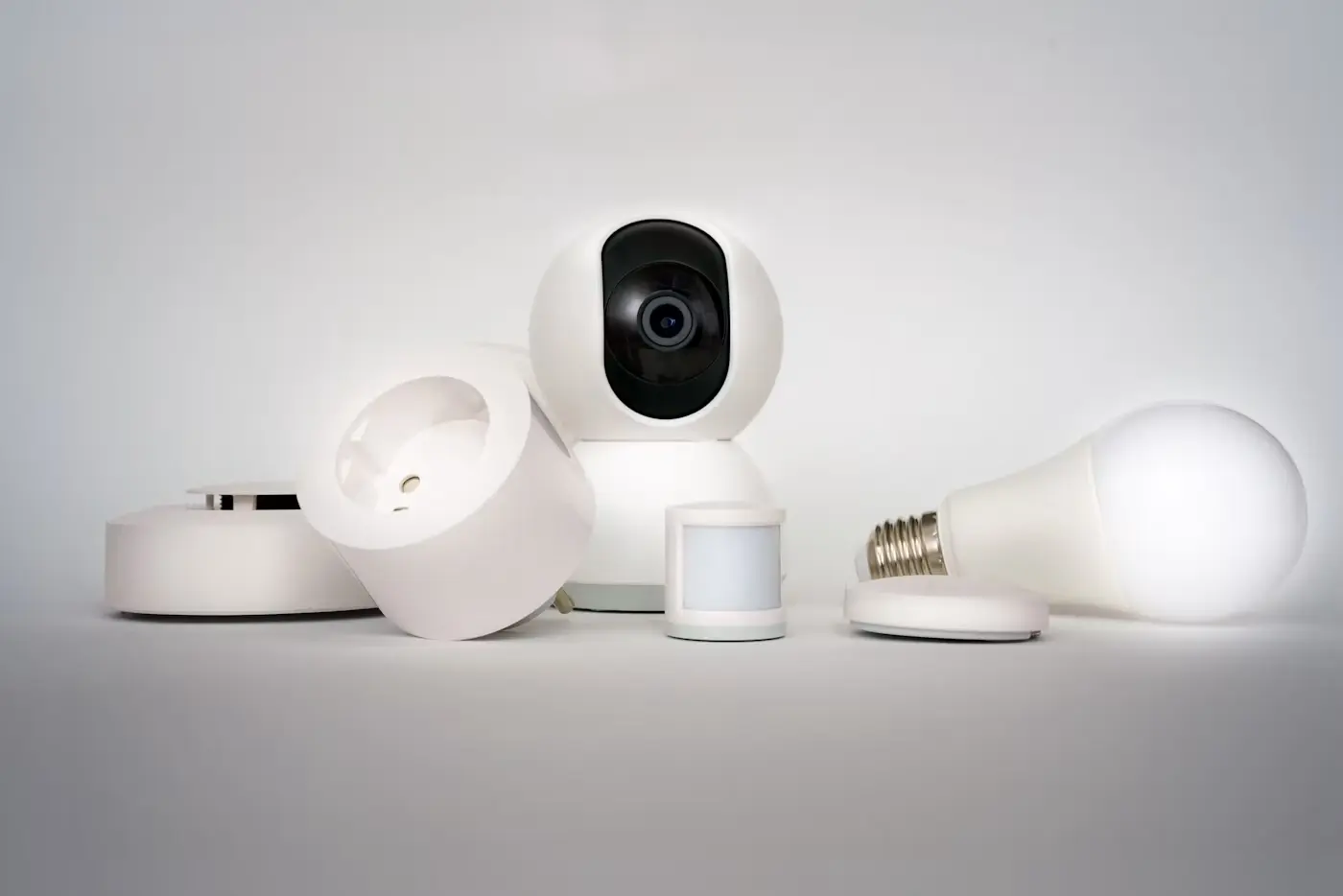 A group of small Zigbee smart home sensors and devices on a table